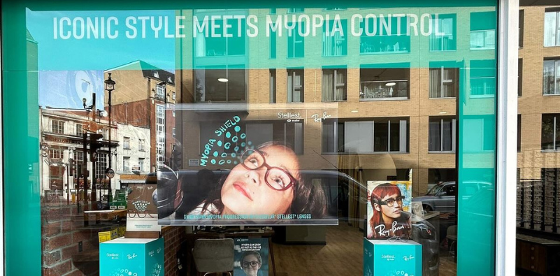 A window display at The Optical Studio showcasing children’s eyecare services.