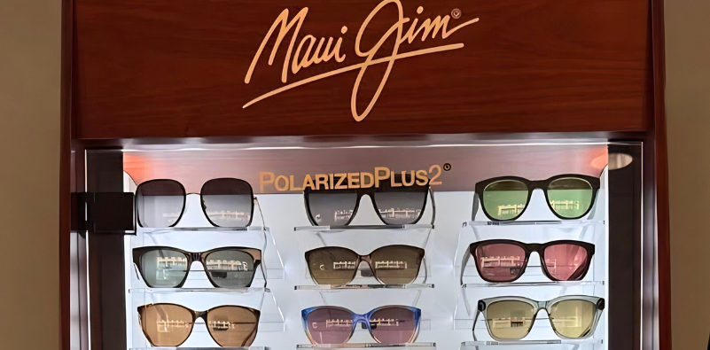 A display case of Maui Jim sunglasses with POLARIZEDPLUS2 written on the glass