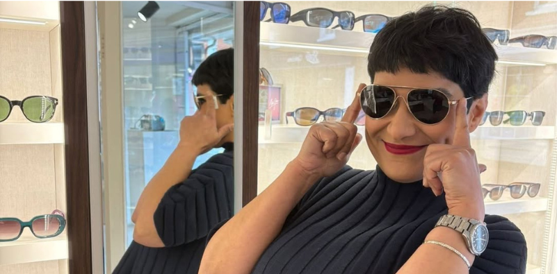 Ladan at The Optical Studio, modelling a pair of sunglasses in practice