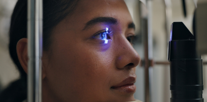 Close up of a woman having her eyes examined with a slit lamp at the opticians.